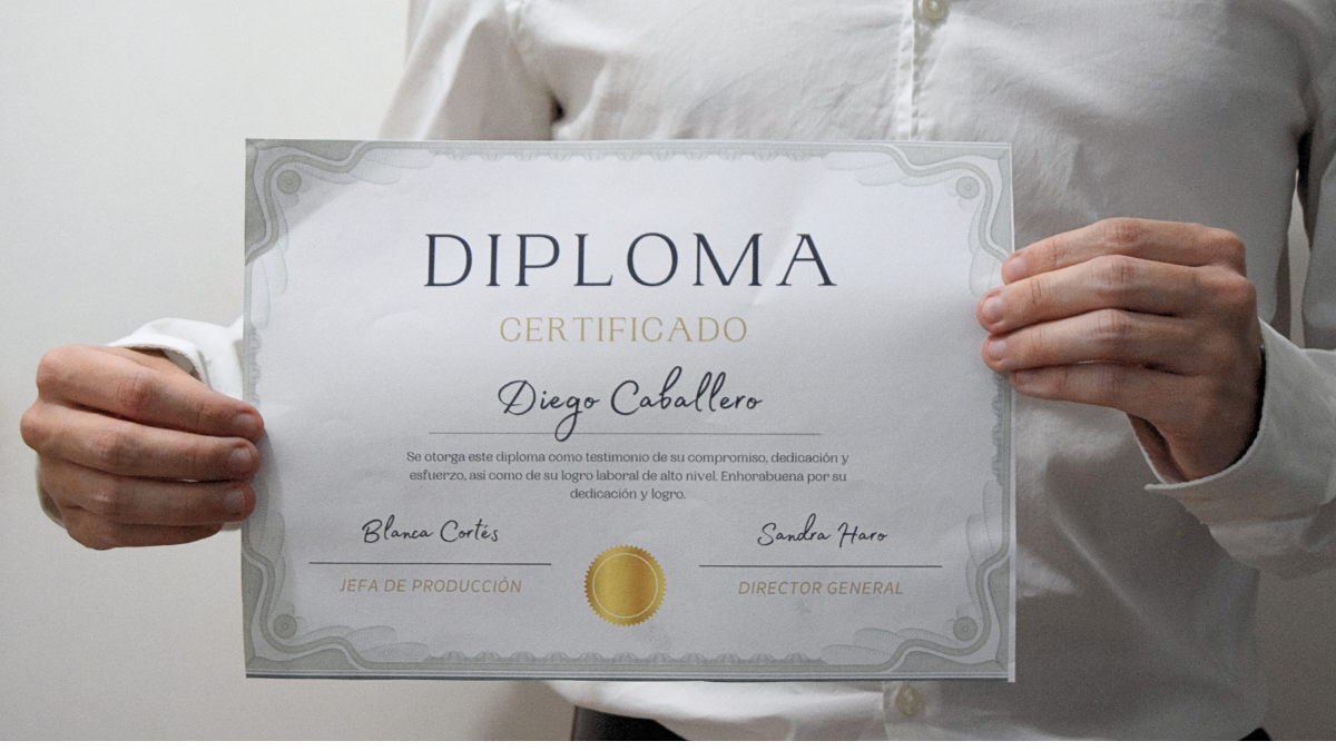 a certificate in a hand