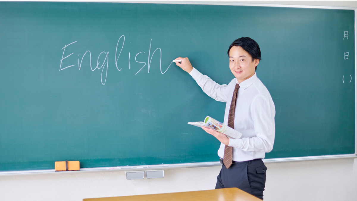 a man writing in a board